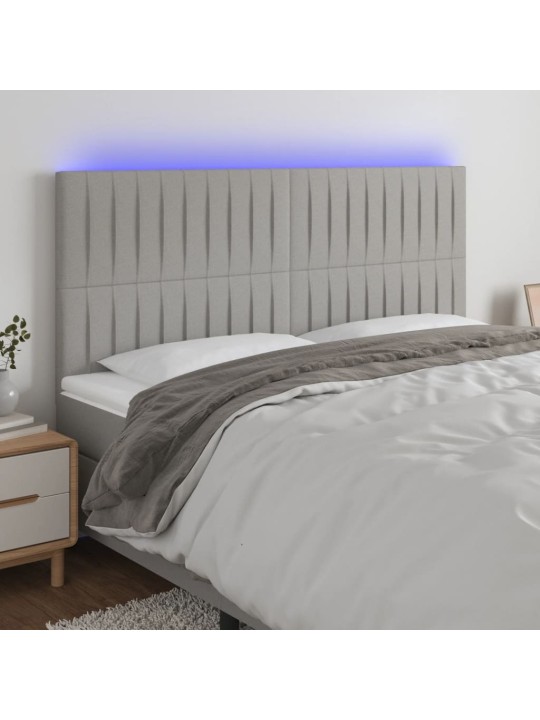 Čelo postele s LED světle šedé 160x5x118/128 cm textil