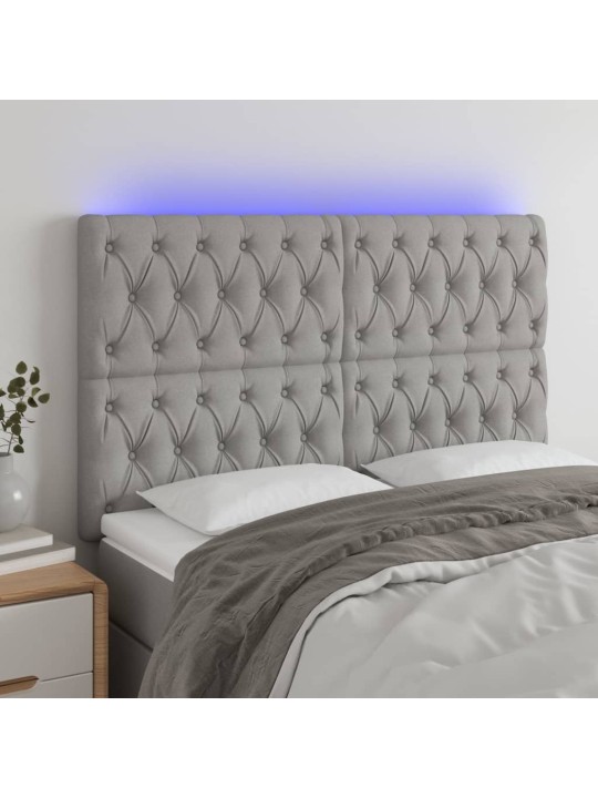 Čelo postele s LED světle šedé 144x7x118/128 cm textil
