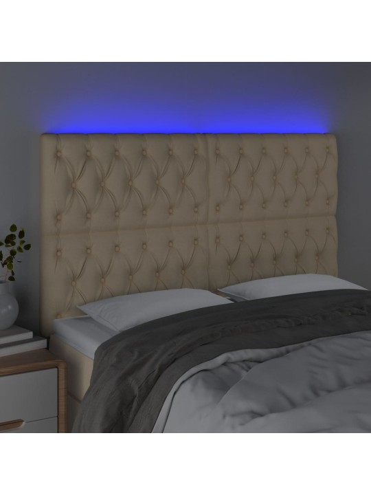 Čelo postele s led krémové 144x7x118/128 cm textil