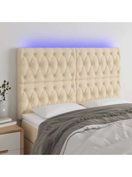 Čelo postele s led krémové 144x7x118/128 cm textil