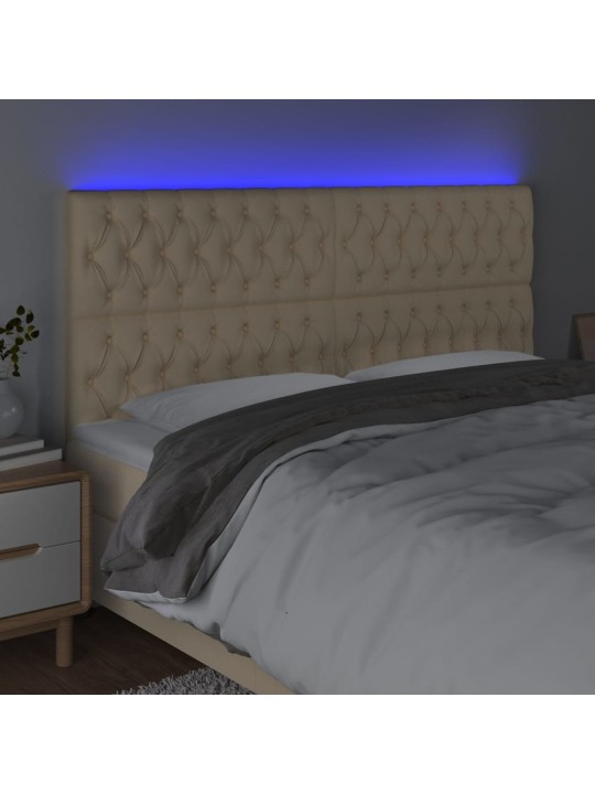 Čelo postele s led krémové 180x7x118/128 cm textil