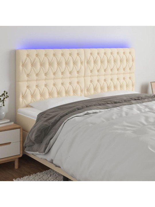 Čelo postele s led krémové 180x7x118/128 cm textil