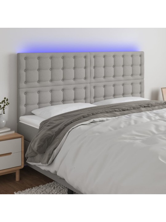 Čelo postele s LED světle šedé 160x5x118/128 cm textil