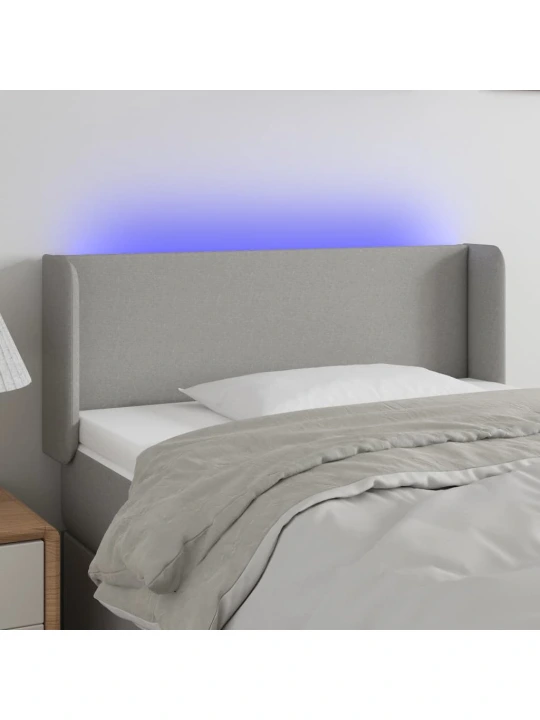 Čelo postele s LED světle šedé 83 x 16 x 78/88 cm textil