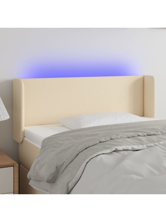 Čelo postele s LED krémové 103 x 16 x 78/88 cm textil