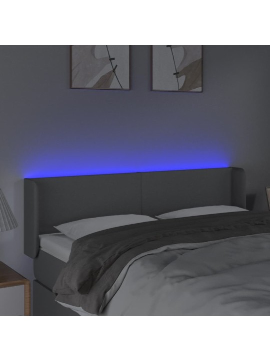 Čelo postele s LED světle šedé 147 x 16 x 78/88 cm textil