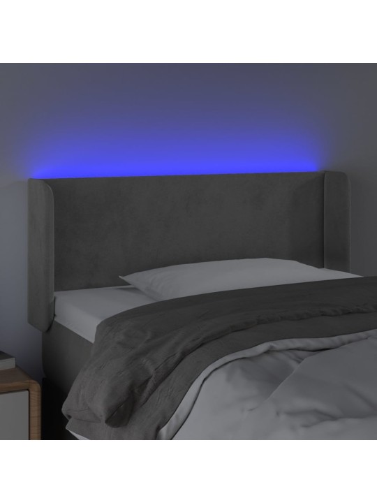 Čelo postele s LED světle šedé 83 x 16 x 78/88 cm samet
