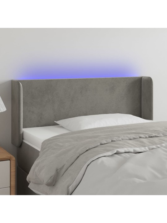 Čelo postele s LED světle šedé 83 x 16 x 78/88 cm samet
