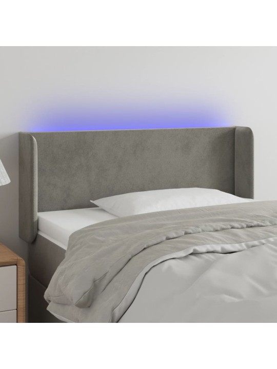 Čelo postele s LED světle šedé 103 x 16 x 78/88 cm samet
