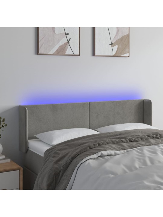 Čelo postele s LED světle šedé 147 x 16 x 78/88 cm samet