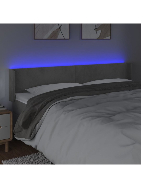 Čelo postele s LED světle šedé 183 x 16 x 78/88 cm samet