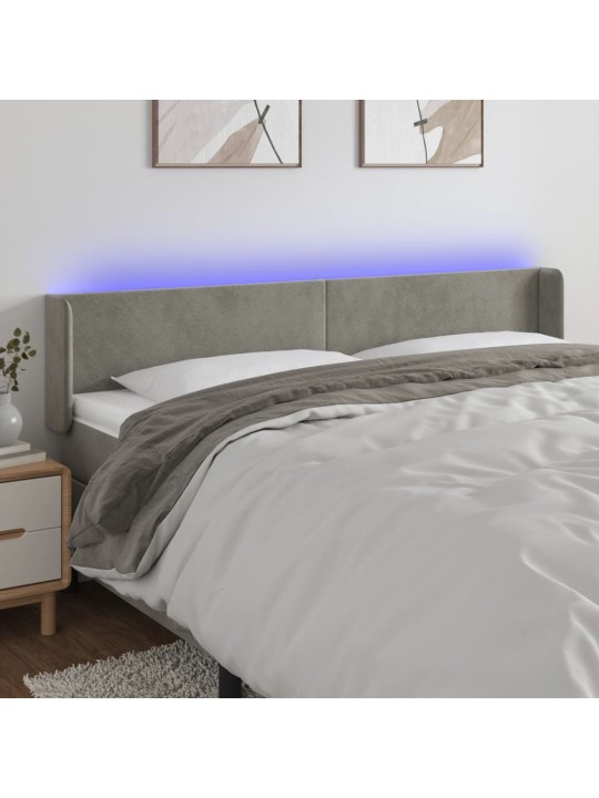 Čelo postele s LED světle šedé 183 x 16 x 78/88 cm samet