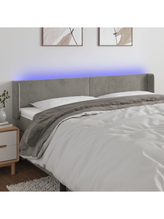 Čelo postele s LED světle šedé 203 x 16 x 78/88 cm samet