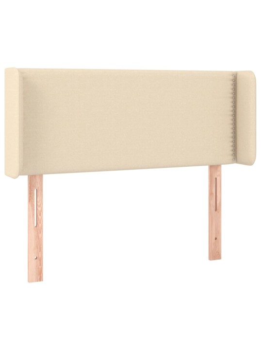 Čelo postele s LED krémové 83 x 16 x 78/88 cm textil