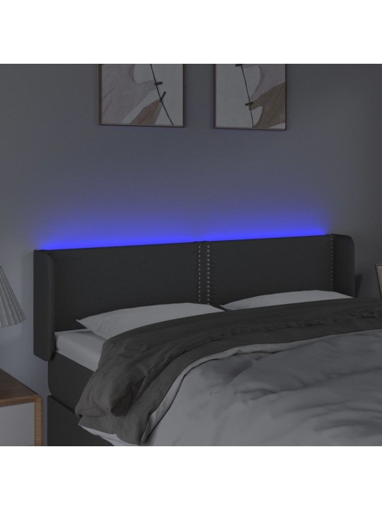 Čelo postele s LED tmavě šedé 147 x 16 x 78/88 cm textil
