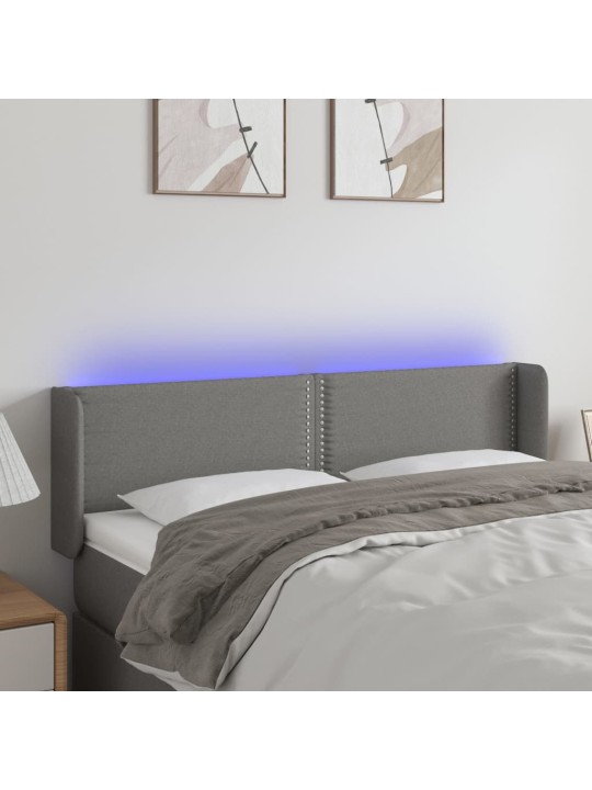 Čelo postele s LED tmavě šedé 147 x 16 x 78/88 cm textil