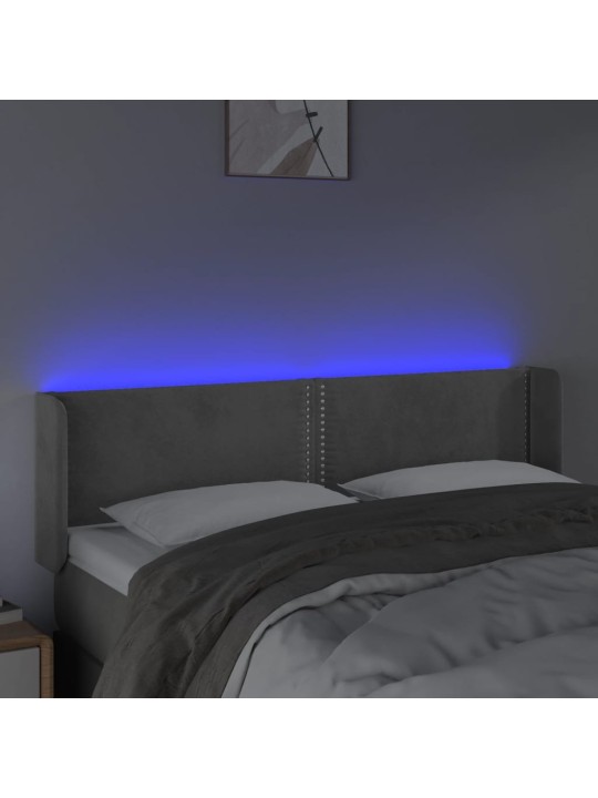 Čelo postele s LED světle šedé 147 x 16 x 78/88 cm samet