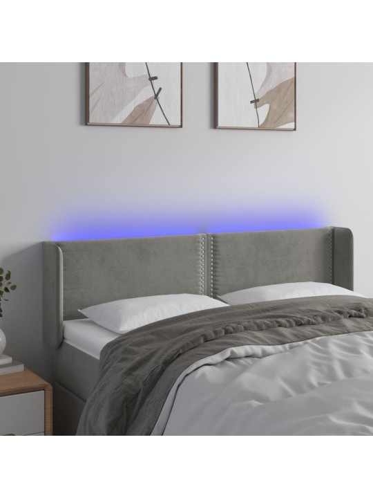 Čelo postele s LED světle šedé 147 x 16 x 78/88 cm samet