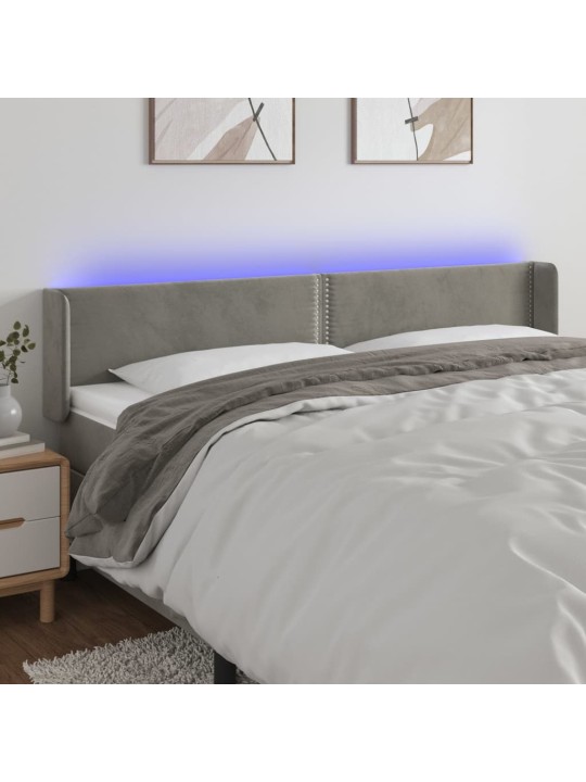 Čelo postele s LED světle šedé 183 x 16 x 78/88 cm samet