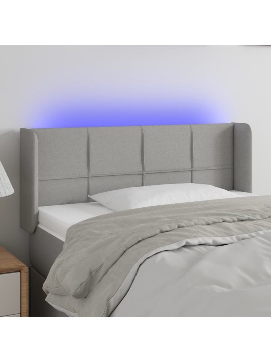 Čelo postele s LED světle šedé 83 x 16 x 78/88 cm textil