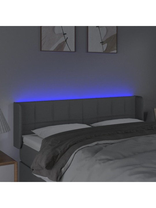 Čelo postele s LED světle šedé 147 x 16 x 78/88 cm textil
