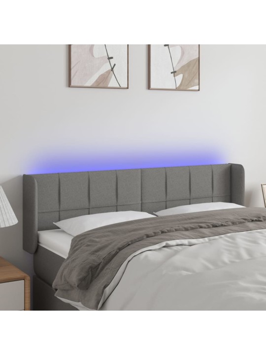 Čelo postele s LED tmavě šedé 147 x 16 x 78/88 cm textil