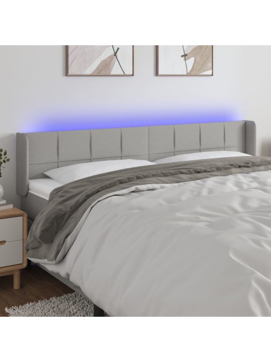 Čelo postele s LED světle šedé 183 x 16 x 78/88 cm textil