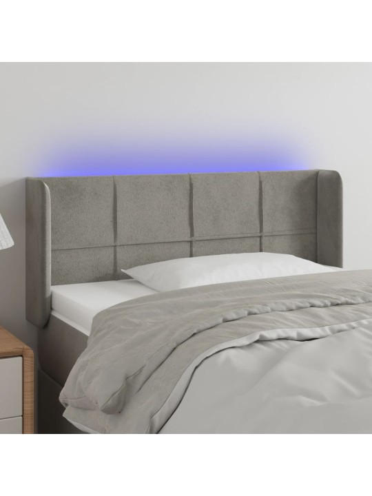 Čelo postele s LED světle šedé 103 x 16 x 78/88 cm samet
