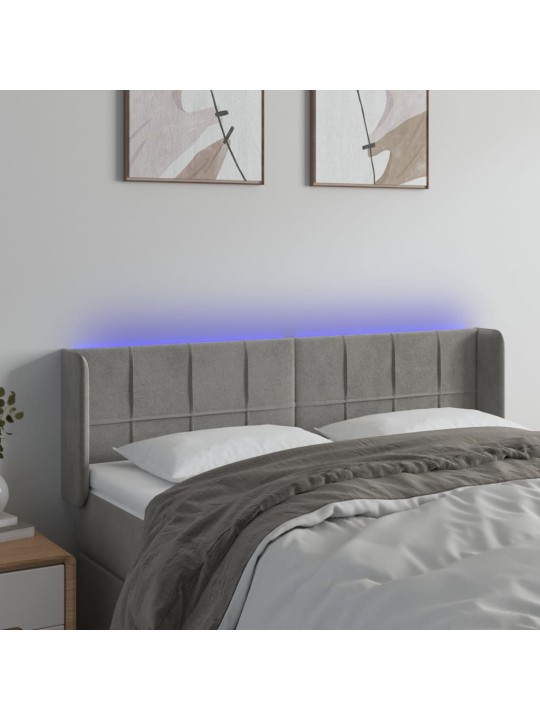 Čelo postele s LED světle šedé 147 x 16 x 78/88 cm samet