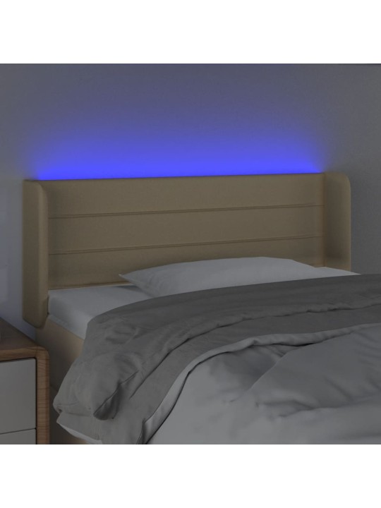 Čelo postele s LED krémové 83 x 16 x 78/88 cm textil