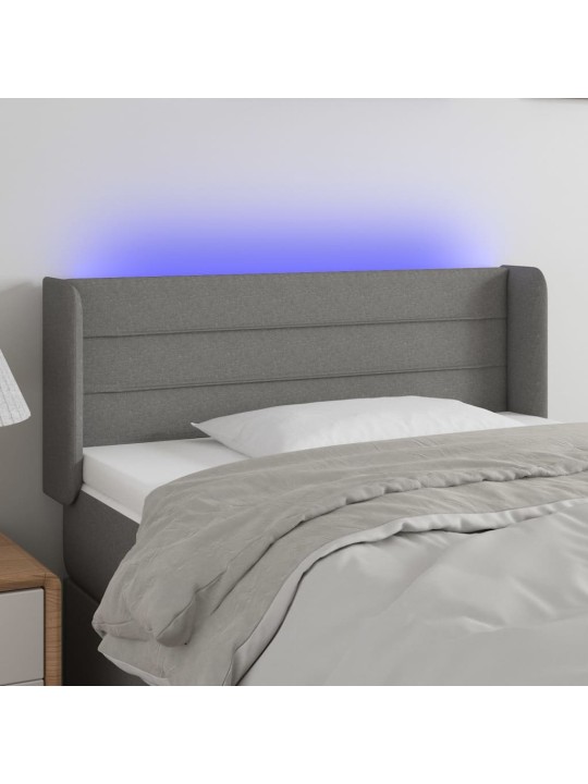 Čelo postele s LED tmavě šedé 103 x 16 x 78/88 cm textil