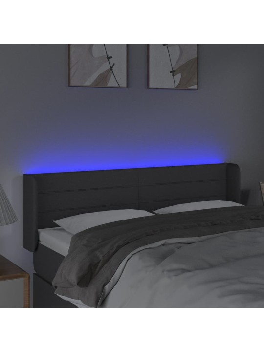 Čelo postele s LED tmavě šedé 147 x 16 x 78/88 cm textil