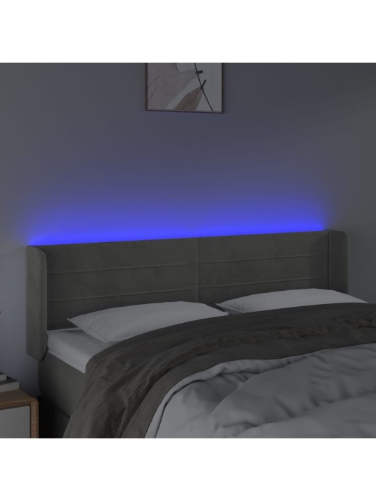 Čelo postele s LED světle šedé 147 x 16 x 78/88 cm samet