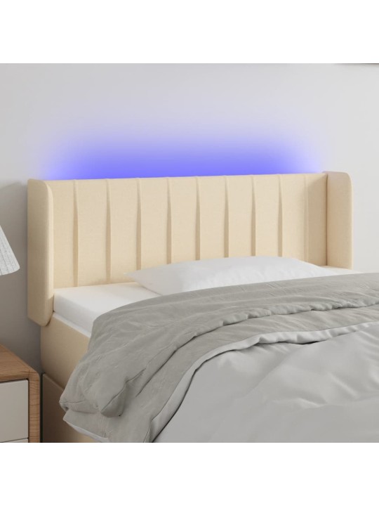Čelo postele s LED krémové 83 x 16 x 78/88 cm textil