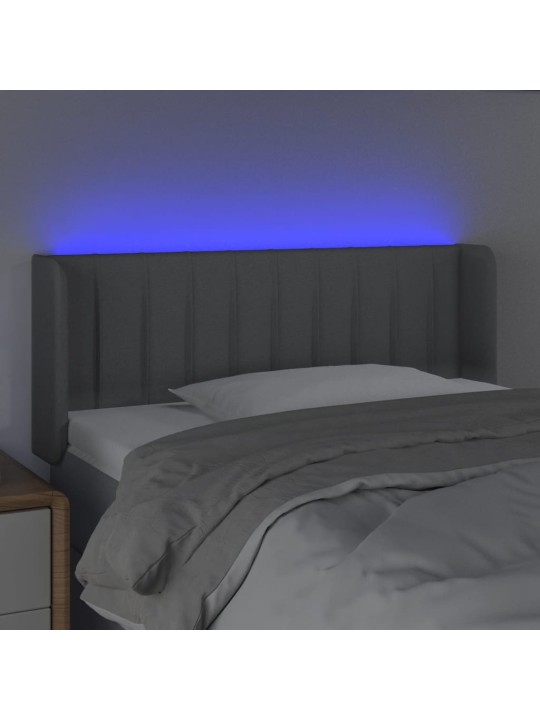 Čelo postele s LED světle šedé 103 x 16 x 78/88 cm textil