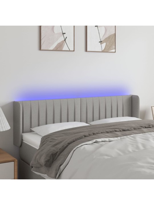 Čelo postele s LED světle šedé 147 x 16 x 78/88 cm textil