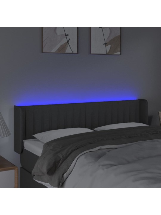 Čelo postele s LED tmavě šedé 147 x 16 x 78/88 cm textil
