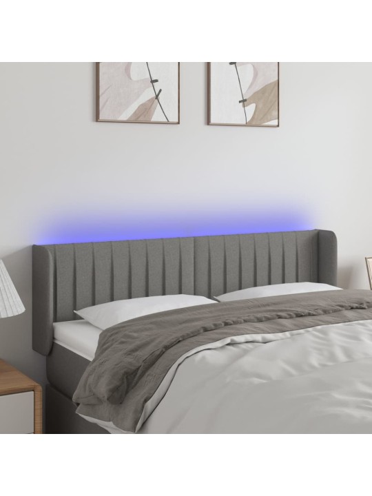Čelo postele s LED tmavě šedé 147 x 16 x 78/88 cm textil
