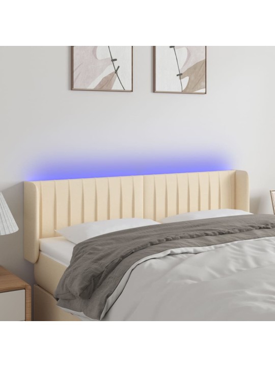 Čelo postele s LED krémové 147 x 16 x 78/88 cm textil