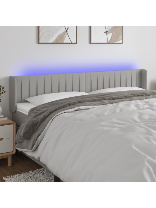 Čelo postele s LED světle šedé 183 x 16 x 78/88 cm textil