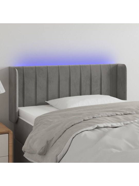 Čelo postele s LED světle šedé 83 x 16 x 78/88 cm samet