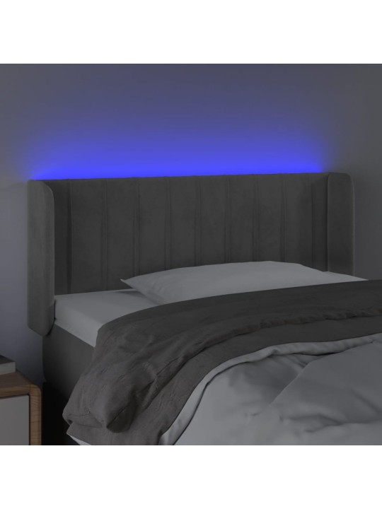 Čelo postele s LED světle šedé 103 x 16 x 78/88 cm samet