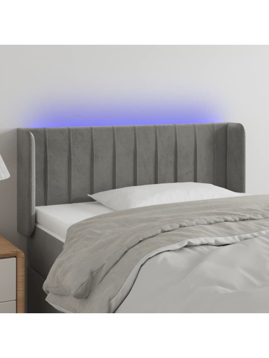Čelo postele s LED světle šedé 103 x 16 x 78/88 cm samet