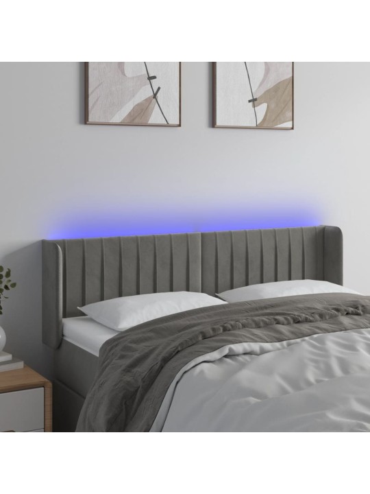 Čelo postele s LED světle šedé 147 x 16 x 78/88 cm samet