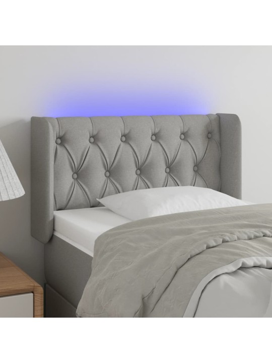 Čelo postele s LED světle šedé 83 x 16 x 78/88 cm textil