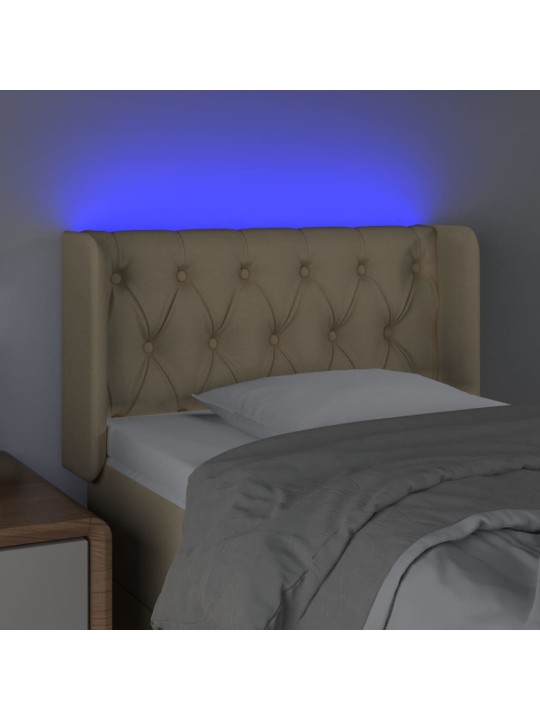 Čelo postele s led krémové 83 x 16 x 78/88 cm textil