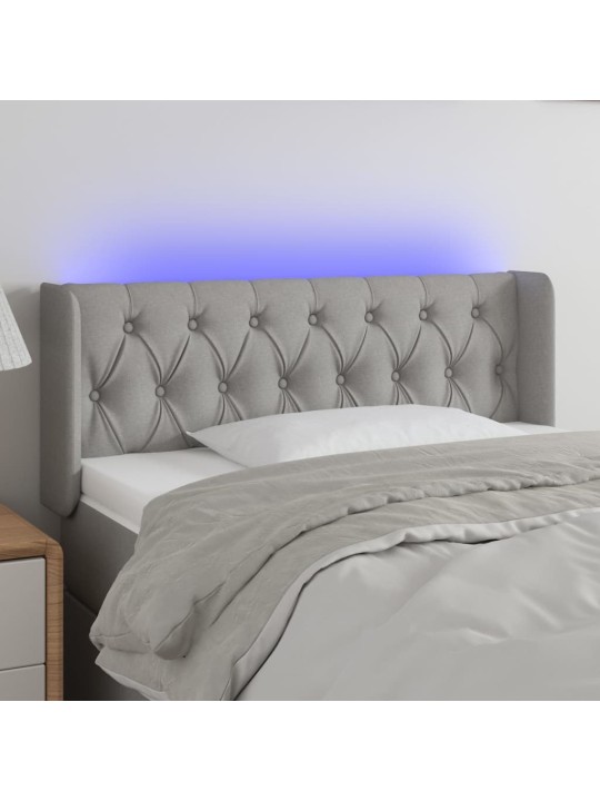 Čelo postele s LED světle šedé 103 x 16 x 78/88 cm textil