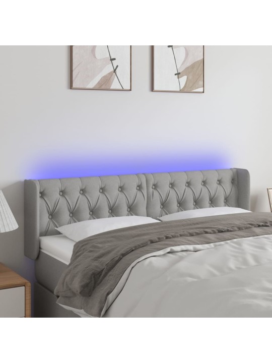 Čelo postele s LED světle šedé 147 x 16 x 78/88 cm textil