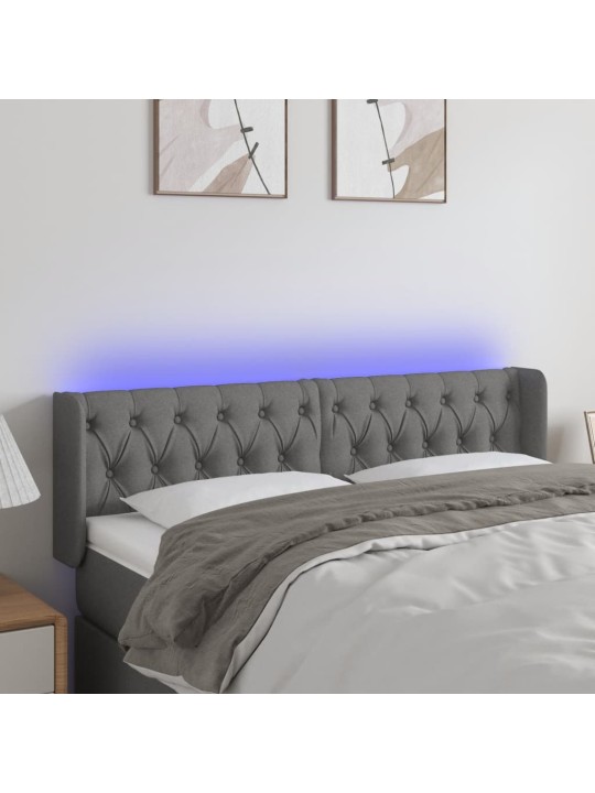 Čelo postele s LED tmavě šedé 147 x 16 x 78/88 cm textil