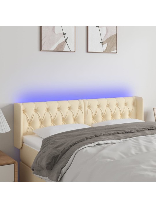 Čelo postele s LED krémové 147 x 16 x 78/88 cm textil